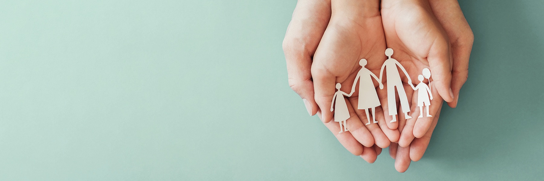 Illustration of hands holding a family.